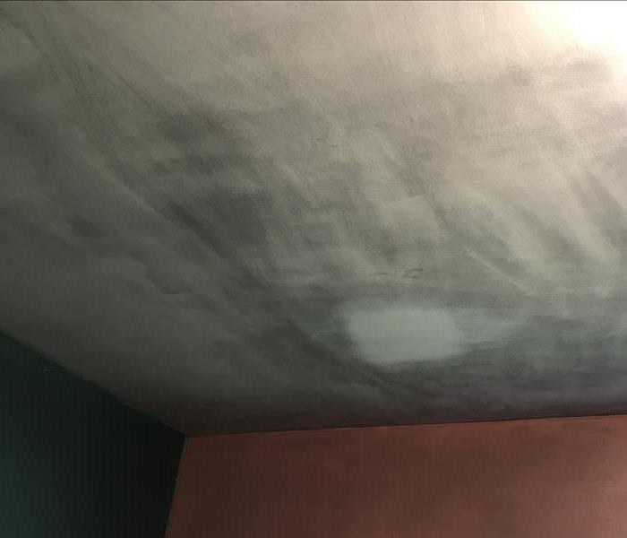 Soot covered ceiling in customers home after a house fire.